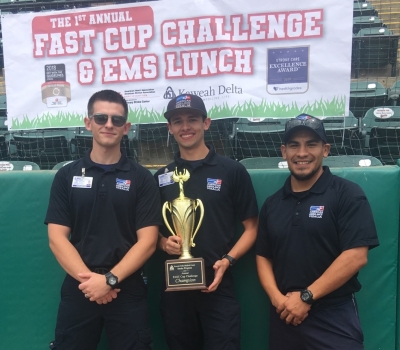 guys holding trophy 